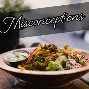 Colorful plant-based bowl with grains, beans, and vegetables.